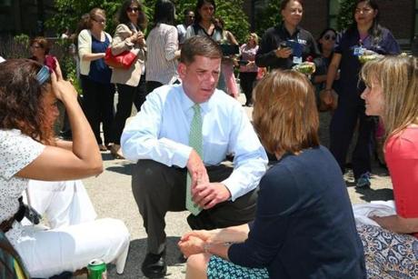 After a press conference at Brigham and Women?s Hospital Monday, Mayor Martin J. Walsh chatted with nurses (from left) Wendy Ortiz, Christine Duchesneau, and Diane Marie Goodwin.
