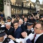 Labour Party opposition leader Jeremy Corbyn (center) reached out to supporters as he left after delivering a speech outside Parliament during a demonstration in central London on Monday.