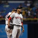 Eduardo Rodriguez was comforted by Xander Bogaerts in the third inning, before he was able to be pulled.