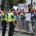 Protesters demonstrated outside the Langham Hotel in Boston?s Financial District, where Donald Trump was hosting a fund-raiser.