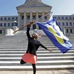 Katherine Day of Jackson, Miss., waved the flag of the Human Rights Campaign on the steps of the Mississippi Capitol in celebration of the judge?s decision on Friday.