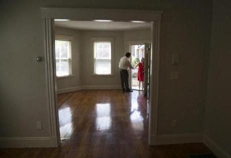 Selling agent Jay Cleary greeted realtor Corie Nagle of Jack Conway Real Estate at a two-bedroom Boston condo for sale.
