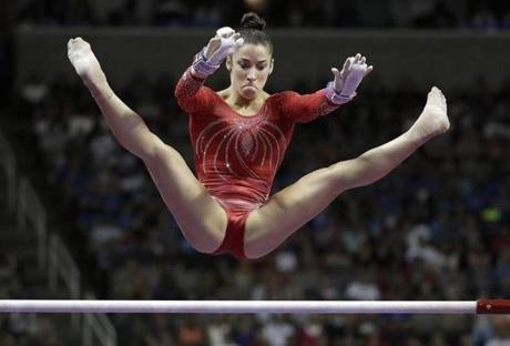 Aly Raisman competes on the uneven bars during the women's U.S. Olympic gymnastics trials in San Jose, Calif., Sunday, July 10, 2016. (AP Photo/Gregory Bull)
