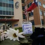 Flowers placed outside Jack Evans Police Headquarters in Dallas on Friday.