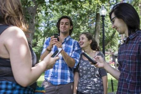 Mary Baker and Travis Bissel chased Pokémon in the Public Garden.
