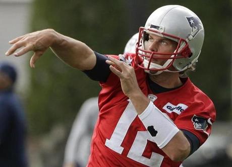 New England Patriots quarterback Tom Brady (12) delivers a pass during an NFL football practice Tuesday, June 7, 2016, in Foxborough, Mass. (AP Photo/Steven Senne)
