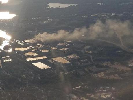 Smoke from a factory fire in Peabody was visible to passengers in a Boston-bound flight Tuesday night.
