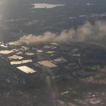 Smoke from a factory fire in Peabody was visible to passengers in a Boston-bound flight Tuesday night.