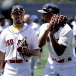 Boston Red Sox's American League All Stars Xander Bogaerts, left, and Mookie Betts walk on the field during batting practice at baseball's All-Star game, Tuesday, July 12, 2016, in San Diego. (AP Photo/Gregory Bull)
