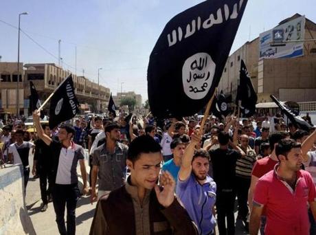 Demonstrators chanted pro-ISIS slogans as they carried the group?s flags in front of the provincial government headquarters in Mosul, Iraq, in 2014.

