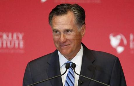 Former Republican U.S. presidential nominee Mitt Romney pauses and smiles as he delivers a speech criticizing current Republican presidential candidate Donald Trump at the Hinckley Institute of Politics at the University of Utah in Salt Lake City, Utah March 3, 2016. REUTERS/Jim Urquhart/File Photo
