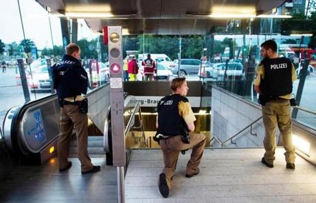 MUNICH SLIDER1 Policemen stand at the underground station Georg-Brauchle-Ring close to the Olympia shopping centre in which a shooting was reported in Munich, southern Germany, Friday July 22, 2016. According to media reports police expect several people being killed. (Lukas Schulze/dpa via AP)

