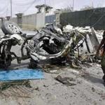 A Somali soldier stood near the wreckage of a blown-up car in Mogadishu on Tuesday.