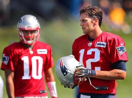 Foxborough-07/28/2016-The New England Patriots held their first day of training camp at the practice fields of Gillette Stadium. Tom Brady takes a breather with Jimmy Garoppolo. Boston Globe staff photo by John Tlumacki(sports)
