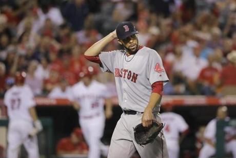 Boston Red Sox starting pitcher David Price walks off the field after the eighth inning of a baseball game against the Los Angeles Angels, Thursday, July 28, 2016, in Anaheim, Calif. (AP Photo/Jae C. Hong)

