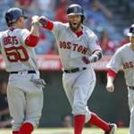 Dustin Pedroia (center) and Mookie Bets celebrated after Pedroia?s pivotal ninth-inning homer.