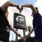 Heather Raleigh and Paige Metelka made a heart shape as they posed outside Pulse nightclub following the mass shooting in Orlando, Fla., on June 12.
