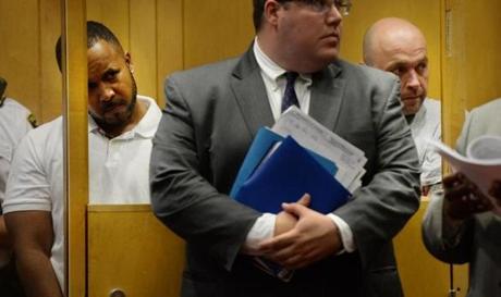 Efrain Montero (left) and David A. Barker sat behind a lawyer during arraignment in Lawrence District Court. 
