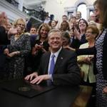 Boston, MA - 8/1/2016 - Governor Charlie Baker smiles after signing major legislation to require pay equity among women and male employees at the State House in Boston, MA, August 1, 2016. (Jessica Rinaldi/Globe Staff) Topic: 02PayEquity