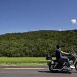 05roadpitch - A motorcyclist travels between pitch sessions during the Fresh Tracks Capital Road Pitch on Route 14 in Williamstown, Vt., on Wednesday, Aug. 3, 2016. Over the course of five days venture capitalists traveled across the state by motorcycle to meet with entrepreneurs and startup companies. (Paul Hayes For The Boston Globe)