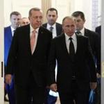 Russian President Vladimir Putin, right, and Turkish President Recep Tayyip Erdogan arrive for talks in the Konstantin palace outside St. Petersburg, Russia, Tuesday, Aug. 9, 2016. On his first foreign visit after Turkey's failed coup, Turkish President Recep Tayyip Erdogan thanked Russian President Vladimir Putin for inviting him for talks Tuesday aimed at repairing ties shattered by Turkey's downing of a Russian warplane along the Syrian border last year. (Alexei Nikolsky/Sputnik, Kremlin Pool Photo via AP)