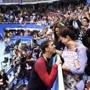 Michael Phelps (left) is congratulated by his partner Nicole Johnson, who was holding their son Boomer.