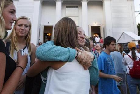 Mourners embraced Tuesday at the First Congressional Church of Princeton during a vigil held for Vanessa Marcotte.
