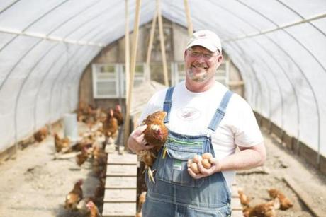 Arthur ?Tad? Largey (pictured among his hens) attributes the texture of the meat produced by his chickens to a stress-free life.

