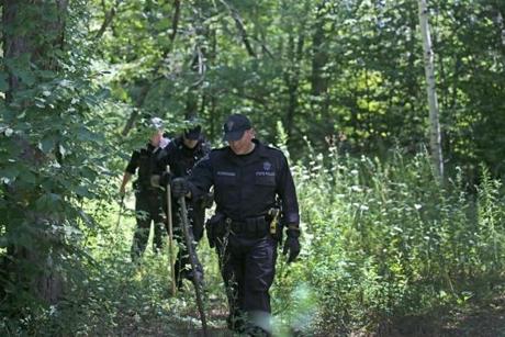 State Police searched the woods off Boylston Avenue in Princeton Monday for evidence in the death of Vanessa Marcotte. 

