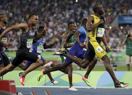 Jamaica's Usain Bolt celebrated as he crosses the line to win gold in the men's 100-meter final.
