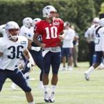 Patriots quarterback Jimmy Garoppolo (10) hit on 13 of 18 passes during practice Monday, then ended the day doing conditioning work with Tom Brady.