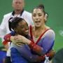 2016 Rio Olympics - Artistic Gymnastics - Final - Women's Floor Final - Rio Olympic Arena - Rio de Janeiro, Brazil - 16/08/2016. Simone Biles (USA) of USA (L) and Alexandra Raisman (USA) of USA (Aly Raisman) celebrate winning the gold and the silver respectively. REUTERS/Mike Blake FOR EDITORIAL USE ONLY. NOT FOR SALE FOR MARKETING OR ADVERTISING CAMPAIGNS. 