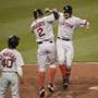 Boston Red Sox's Mookie Betts, right, celebrates his three-run home run with Xander Bogaerts (2) and Andrew Benintendi (40) during the fifth inning of a baseball game against the Baltimore Orioles, Tuesday, Aug. 16, 2016, in Baltimore. (AP Photo/Nick Wass)