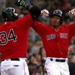 Boston, MA - 7/22/2016 - (1st inning) Boston Red Sox right fielder Mookie Betts (50) celebrates his leadoff home run with Boston Red Sox designated hitter David Ortiz (34) during the first inning. The Boston Red Sox take on the Minnesota Twins in Game 2 of a 4 game series at Fenway Park. - (Barry Chin/Globe Staff), Section: Sports, Reporter: Peter Abraham, Topic: 23Red Sox-Twins, LOID: 8.2.3687102459 .