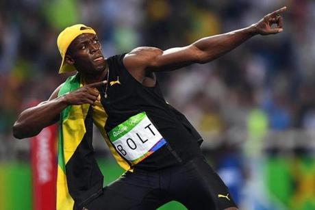 Usain Bolt of Jamaica celebrates after placing first and the gold medal in the men?s 100m final race the Olympic Stadium. 
