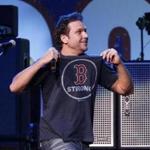 Dane Cook on stage in 2013 at the Boston Strong benefit.