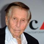 FILE - In this April 20, 2013, file photo, media mogul Sumner Redstone arrives at the 2013 MOCA Gala celebrating the opening of the Urs Fischer exhibition at MOCA, in Los Angeles. According to an internal memo, Viacom CEO Philippe Dauman will step down, making Chief Operating Officer Tom Dooley interim CEO. The move is part of a settlement the Viacom board approved with National Amusements, a private company owned by the 93-year-old Redstone that holds controlling stakes in both Viacom and CBS. (Photo by Richard Shotwell/Invision/AP, File)