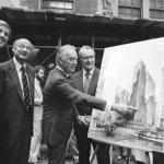 FILE - In this June 28, 1978, file photo, then New York Gov Hugh Carey points to an artists' conception of the new New York Hyatt Hotel/Convention facility that will be build on the site of the former Commordore Hotel, in New York. At the launching ceremony are, from left: Donald Trump, son of the city developer Fred C. Trump; Mayor Ed Koch of New York; Carey; and Robert T. Dormer, executive vice president of the Urban Development Corp. (AP Photo, File)