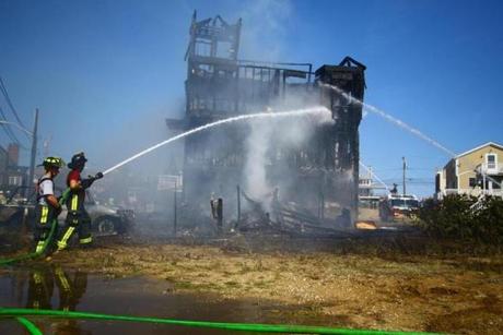Crews doused the site of the fire on Saturday.
