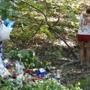 Lunenburg, MA - 8/28/2016 - Mourners embrace at a makeshift memorial for Austin Robbins at the site where he was killed in a car crash in Lunenburg, MA, August 28, 2016. (Jessica Rinaldi/Globe Staff) Topic: 29lunenburg 