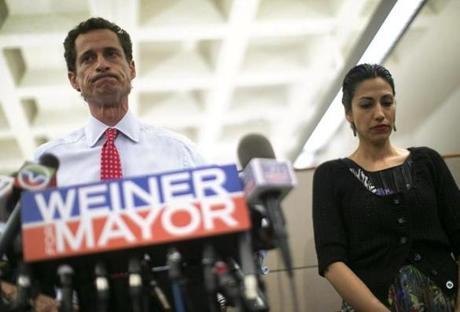 New York mayoral candidate Anthony Weiner and his wife Huma Abedin attended a news conference in New York in 2013. 
