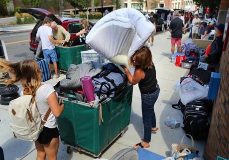 Family members and Boston University volunteers helped students move in to the West Campus dorms last year. 
