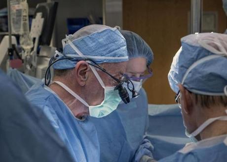 Surgeon wearing surgical caps while at work at Cleveland Clinic Center in March.  
