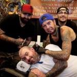 Steve Cummings, Davey Lewis, and Mike Boisvert, all of Tattoo Angus, posed with customer Ryan Manning, of Chelmsford, at last year?s Massachusetts Tattoo Convention in Boston. 