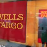 A Wells Fargo sign is seen outside a banking branch in New York in this July 13, 2012, file photo. Wells Fargo & Co is slashing an approved list of money managers and investment vehicles that its stockbrokers market to the firm's wealthy clients, a change of direction that has rattled the third-largest U.S. brokerage network, April 15, 2013. REUTERS/Shannon Stapleton/Files (UNITED STATES - Tags: BUSINESS LOGO)