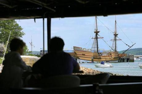 Plymouth- 6/9/2016 Surfside Smokehouse on the Plymouth waterfront, and the view from the deck with the Mayflower ll ship nearby Plymouth Rock. Boston Globe staff photo by John Tlumacki(south)
