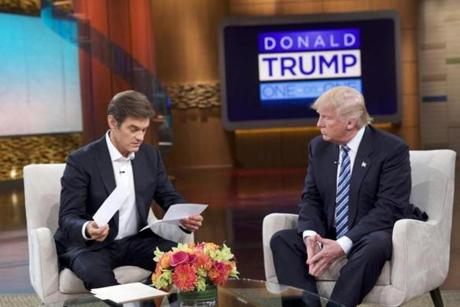 This image released by Sony Pictures Entertainment shows Dr. Oz, left, and Republican presidential candidate Donald Trump during a taping of 