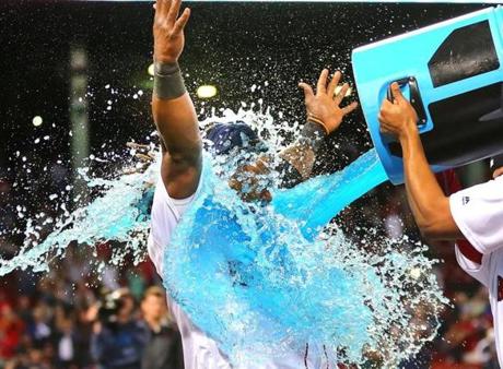 Boston-09/15/2016- Boston Red Sox vs Yankees- Sox Hanley Ramirez gets showered with a cooler of sports drink at the end of the game as the team celebrated his 9th inning 3-run game winning homer.Boston Globe staff photo by John Tlumacki(sports)
