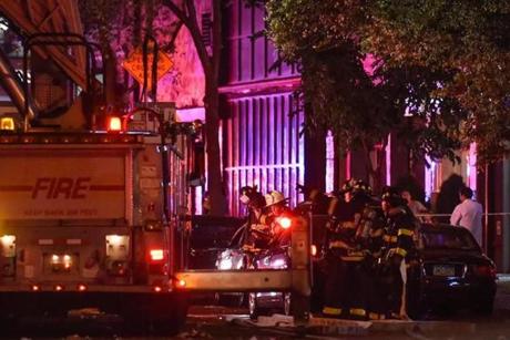 New York City firefighters stood near the site of an explosion in the Chelsea neighborhood of Manhattan, New York.
