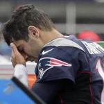 New England Patriots quarterback Jimmy Garoppolo leaves the field after an injury during the first half of an NFL football game against the Miami Dolphins, Sunday, Sept. 18, 2016, in Foxborough, Mass. Garoppolo did not return to the game. (AP Photo/Charles Krupa)